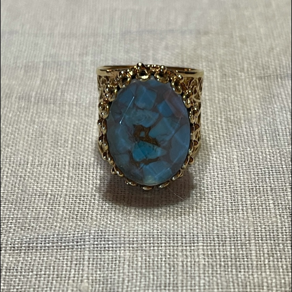 Gold ring with blue stone
